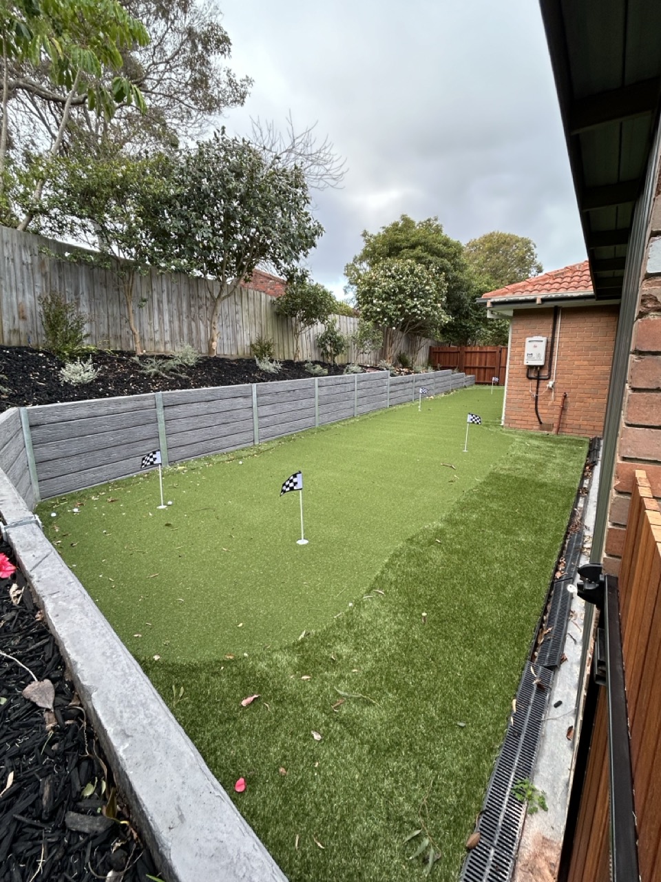 Custom synthetic putting green installation