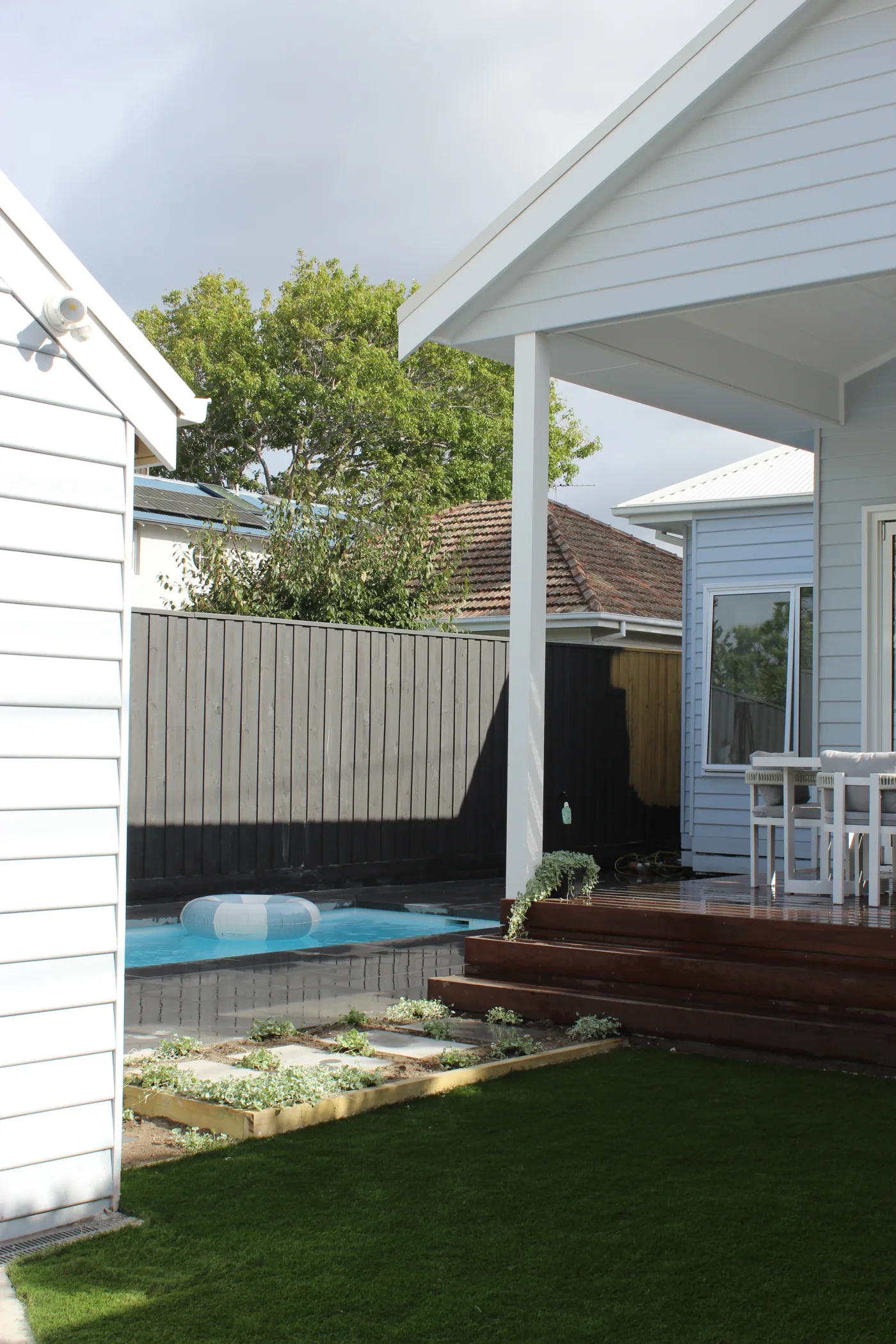 Finished backyard with turf and garden beds